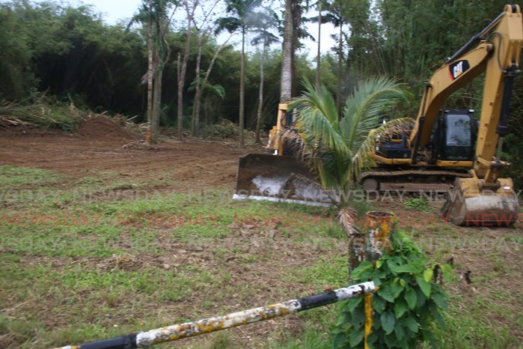 Workers have begun to clear land to be used for a carpark on the Tucker Valley Road, Chaguaramas, just before Macqueripe Beach Facility on Wednesday. The carpark is intended for use by visitors ot the nearby Bamboo Cathedral. - SUREASH CHOLAI