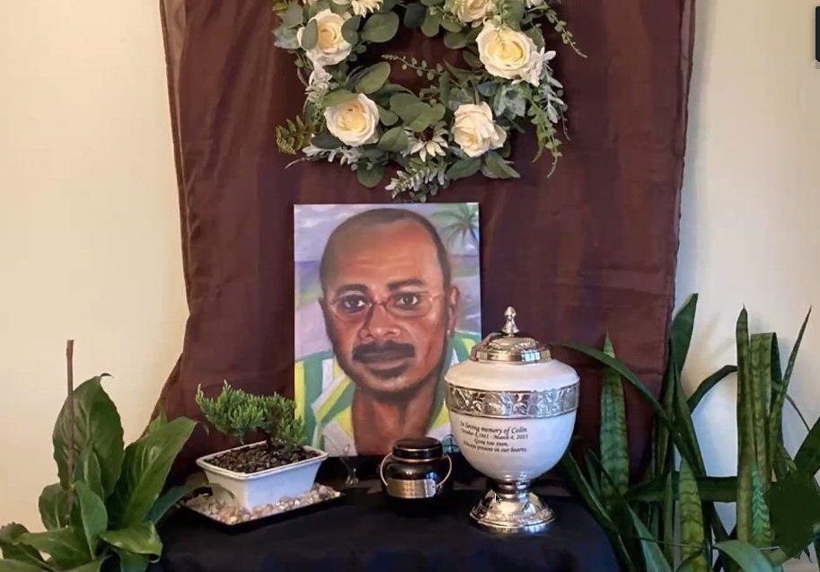 A mini-shrine to Colin Robinson shown during his memorial