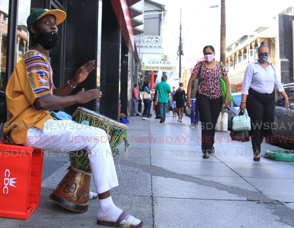 Laventille resident Kevin Griffith entertains passers by while beating his drum on Frederick Street, Port of Spain. Photo by Ayanna Kinsale