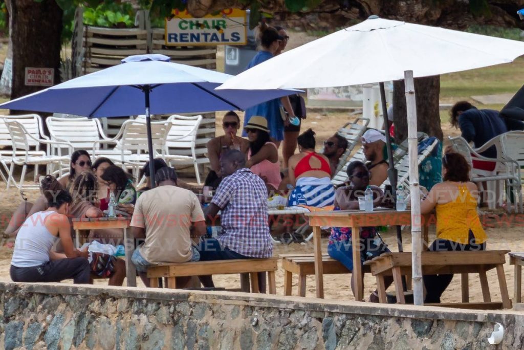 Limers enjoy a relaxing day on Sunday at Mt Irvine Beach Bar, Tobago.  - DAVID REID 