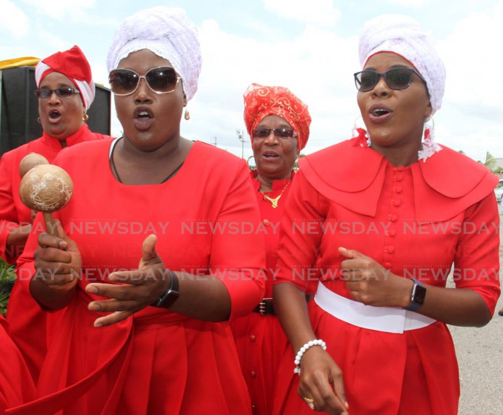 Women sing at the Spiritual Shouter Baptist Liberation Day celebrations at the Eddie Hart Ground in Tacarigua in 2019. - Angelo Marcelle