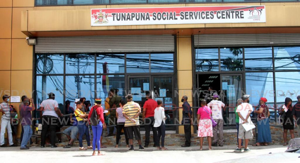 In this photo taken in June 2020, people wait in line at the Tunapuna Social Services Centre. ACCA has urged governments to adopt the use of gender responsive budgeting (GRB) to ensure women and men alike benefit equally from the economic recovery out of covid19. - Angelo Marcelle