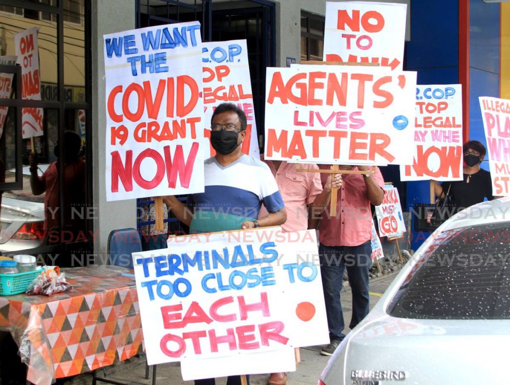 Members of the Electronic Lotto Agents Association protest in front the National Lotteries Control Board (NLCB) on Queen Street, Port of Spain in July last year. 