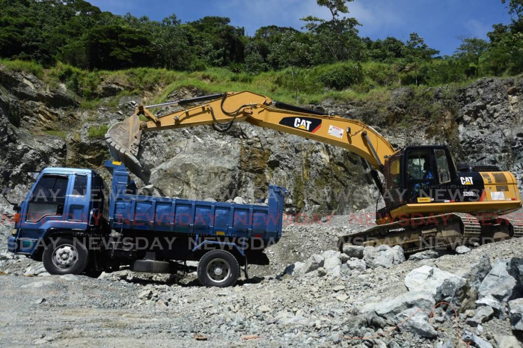 A backhoe offloads large pieces of stone at the Nordberg Crushing Plant at the Studley Park Quarry on the Windward Road, Tobago in this 2020 photo. - Photo by Ayanna Kinsale 