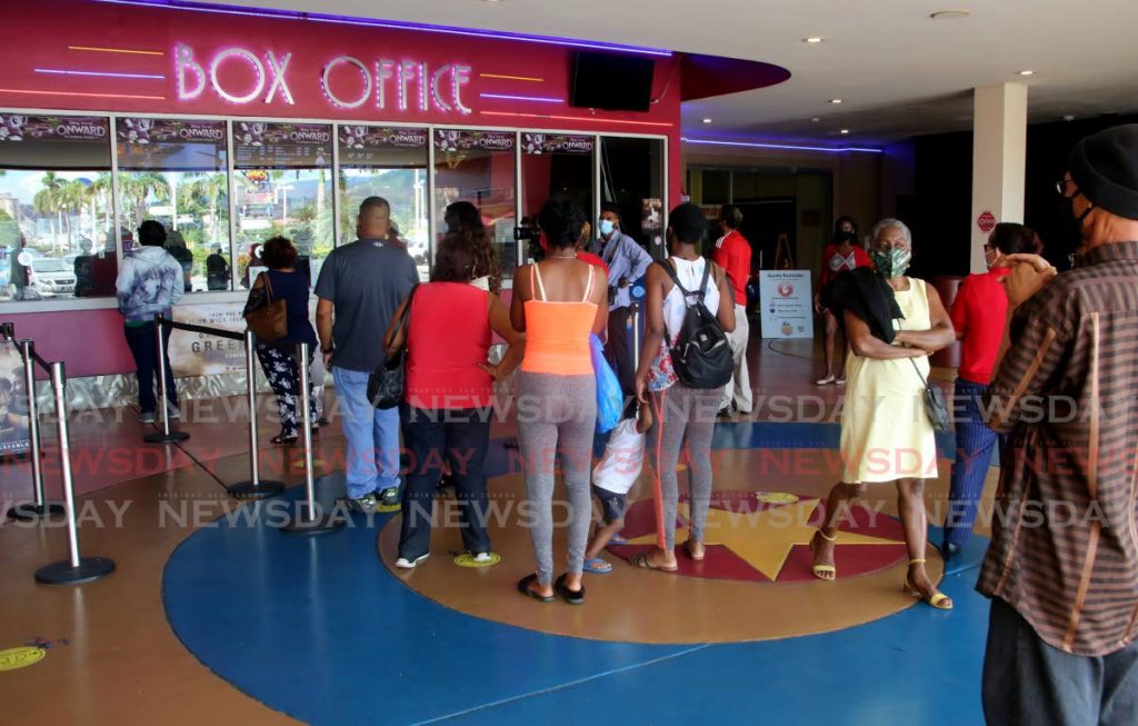 File photo of patrons at MovieTowne, Port of Spain, box office. - 