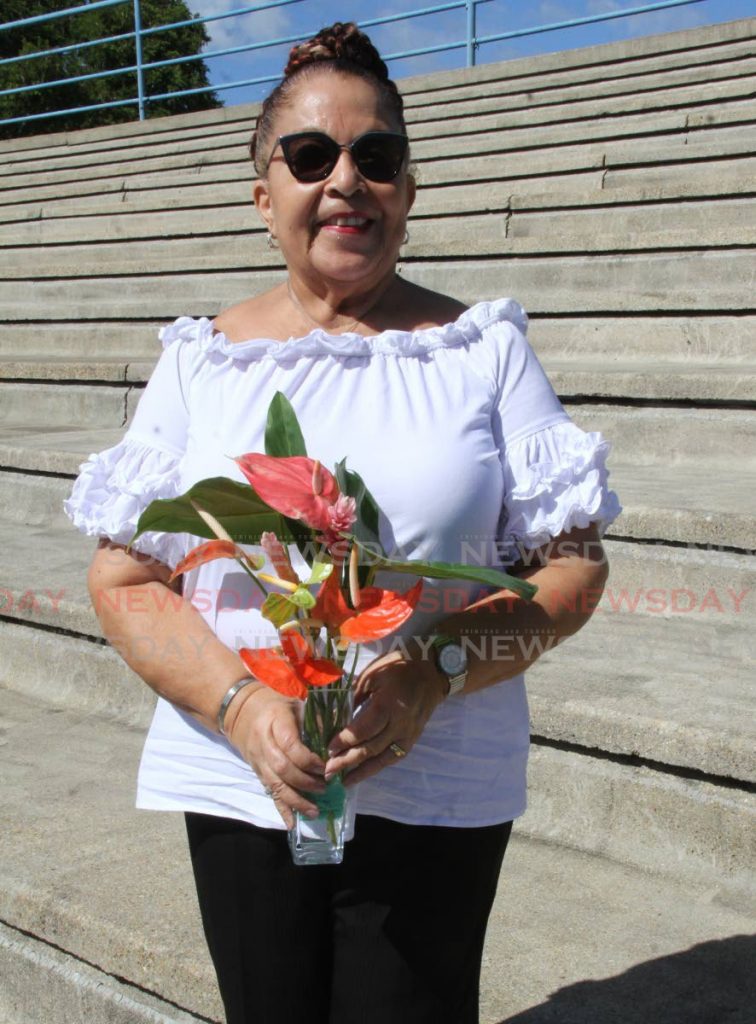 Maureen Subero-Campbell holds a bouquet of anthuriums. She presented Princess Margaret with a similiar one in 1955. - Angelo Marcelle