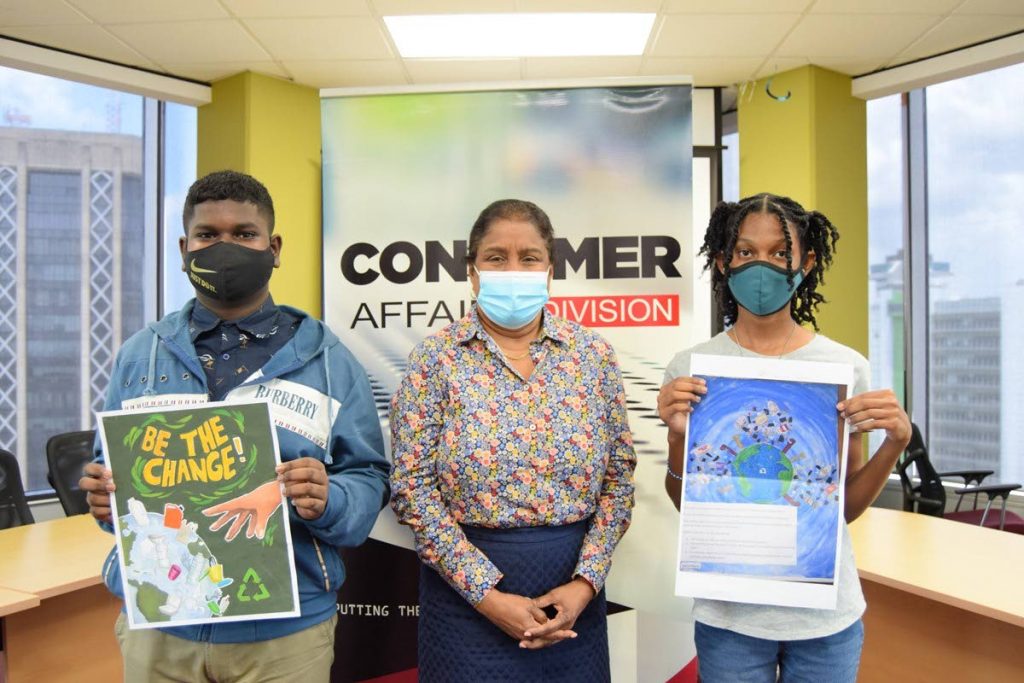 Minister of Trade and Industry Paula Gopee-Scoon, centre, is flanked by competition winners Kester Branche, left, and Tahlia Peters  with their winning art pieces.

 - 