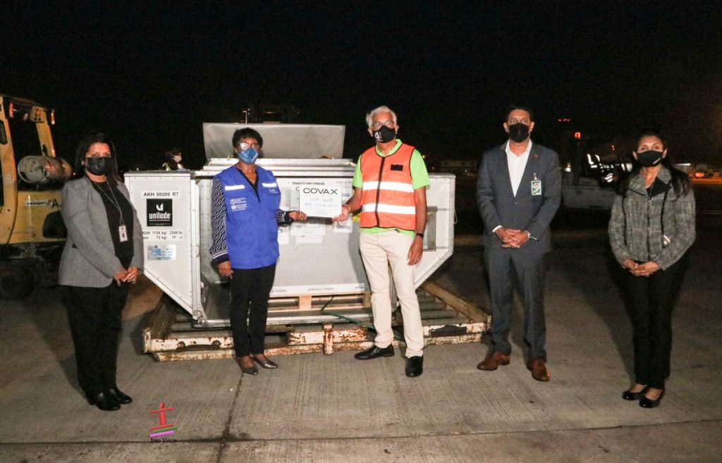 On Tuesday, TT received the first batch of vaccines through the Covax facility. Receiving the vaccines at the Piarco International airport are, from left, Anesa Doodnath-Siboo, acting principal pharmacist at the Ministry of Health; PAHO/WHO country representative Dr Erica Wheeler; Health Minister Terrence Dayalsingh; chief medical officer Dr Roshan Parasaram; and Grace Sookchand, manager, Expanded Programme on Immunization. Photo taken from Ministry of Health Facebook page - 