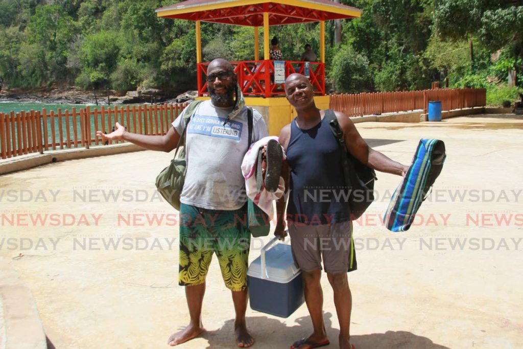 Water was great!
Nixon Walker and Reggie Gregg, leave the beach after spend a fun day in the sun,
Macqeuripe Beach, Chaguaramas. Photo by Roger Jacob