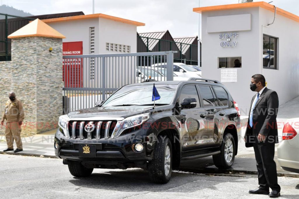 A security official looks on as President Paula Mae-Weekes and her mother Phyllis Weekes are driven out of the Diego Martin Health Centre after they got vaccinated for covid19 on Tuesday. Photo by Vidya Thurab