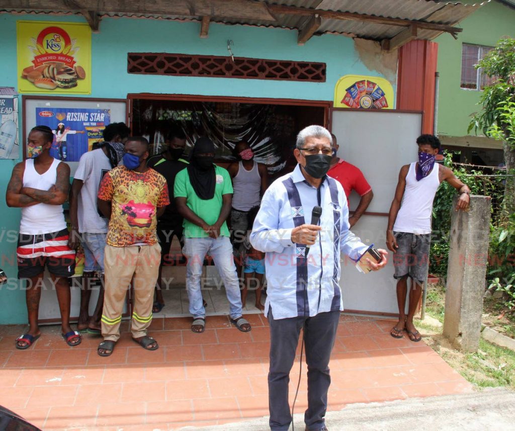 MSJ Political Leader David Abdullah, is joined by residents of Silk Cotton Drive, Marabella on Thursday, to speak about the damage caused by NIQuan Energy Plantś explosion. - Photo by Angelo Marcelle