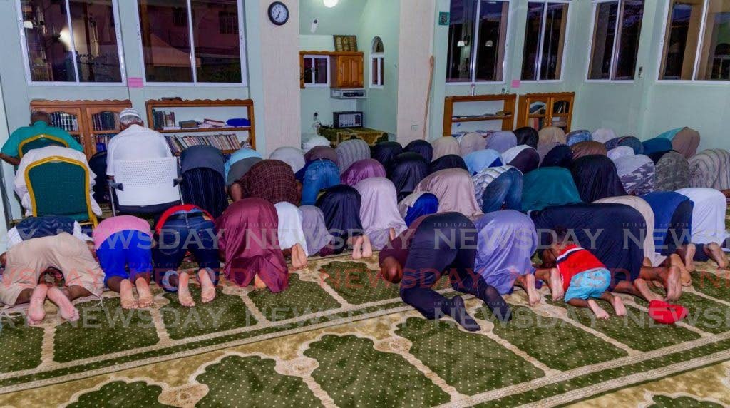 In this file photo, Muslims participate in Ramadan prayers at a mosque in TT. - 