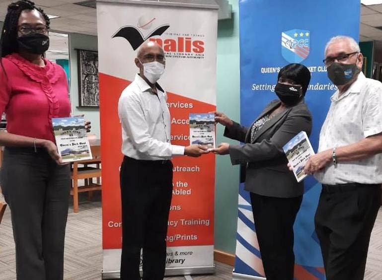 Author Nasser Khan, second from left, presents a copy of his latest book to Charmaine Glasgow, director, Heritage Division at NALIS. Looking on are Debbie Goodman, manager, NALIS Corporate Communications and Colin Murray, honourary secretary of Queen's Park Cricket Club. Photo courtesy Nalis 
