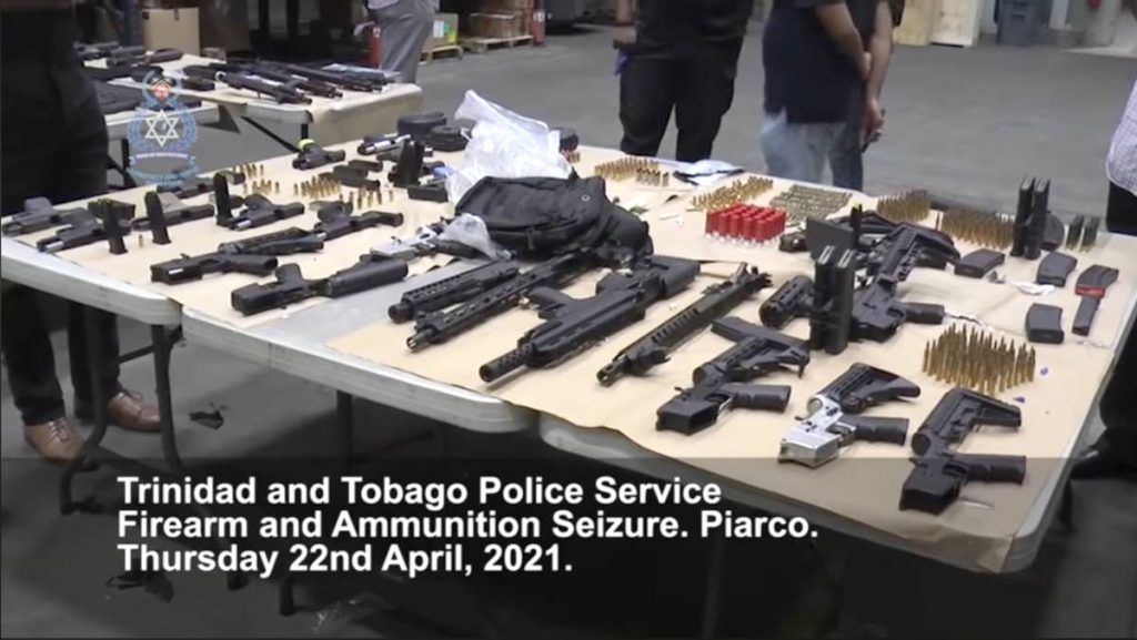 A screenshot of police video depicting some of the weapons seized at a Piarco bond on Thursday. - 