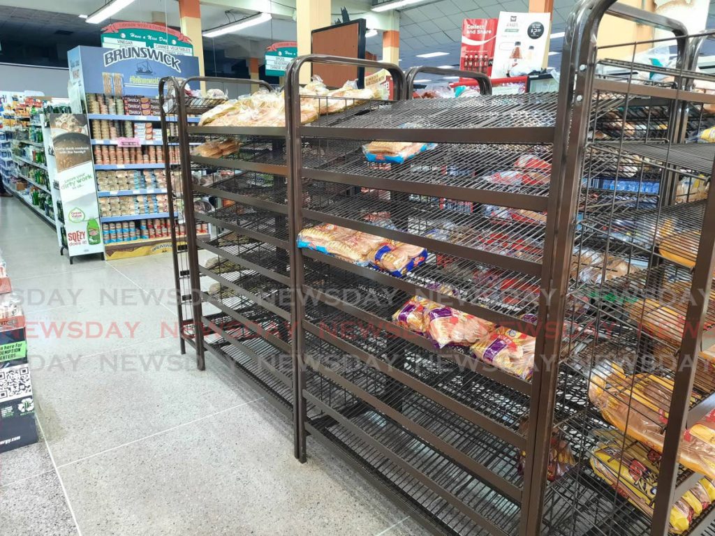 A mostly-empty Kiss bread display stand at a popular supermarket in South Trinidad. - Lincoln Holder