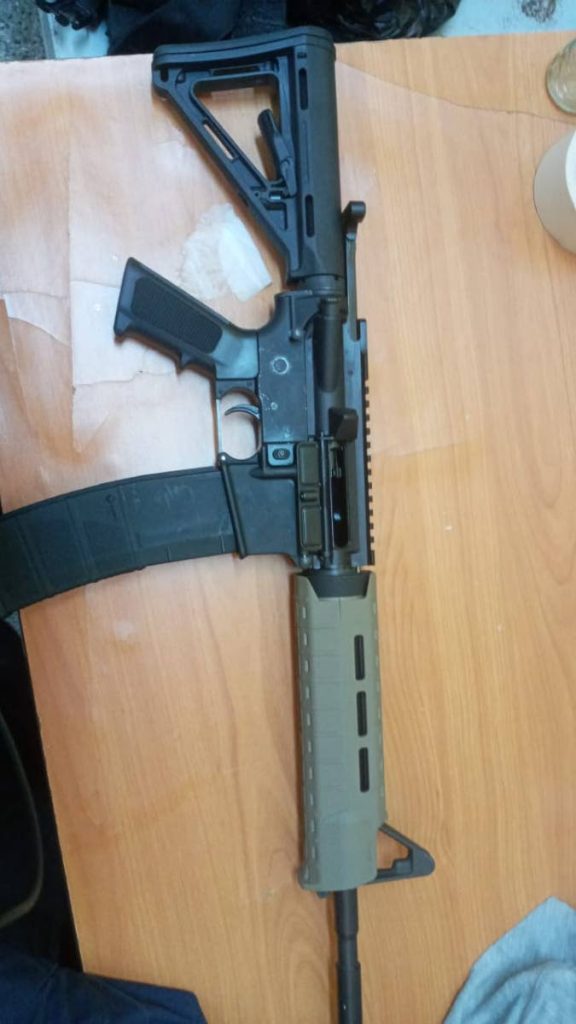 An assault rifle was seized by members of the Port of Spain Task Force on Monday morning in Leau Place, Laventille. 
Three people were held. 

PHOTO COURTESY TTPS 