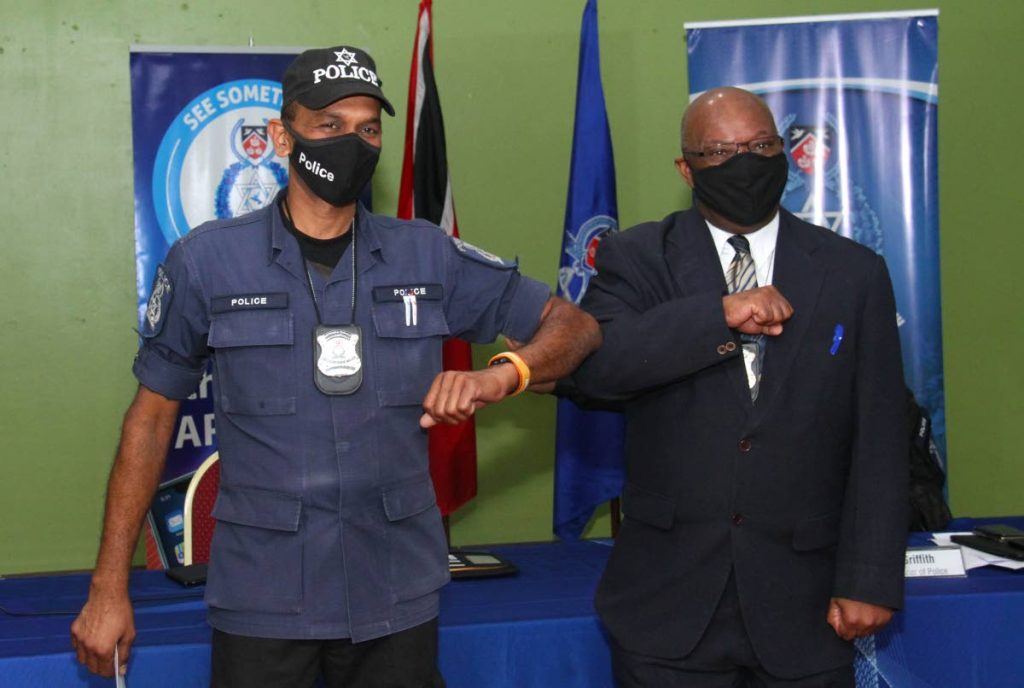 PC Sujeet Ramcharan, left, of the La Romaine police post and DCP McDonald Jacob at the Police Administration Building in Port of Spain on Wednesday.  -Photo by Ayanna Kinsale