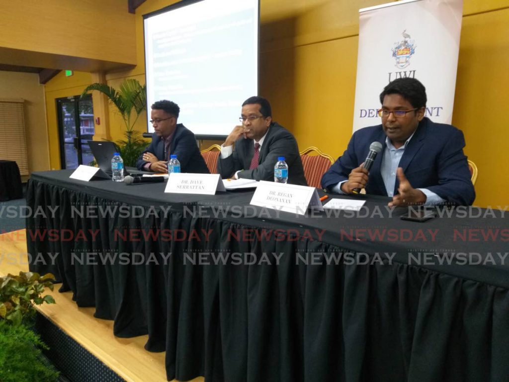UWI lecturers (L-R) Dr Daren Conrad, Dr Dave Seerattan and Dr Regan Deonanan speak at a post-budget analysis during UWI's Conference on the Economy on October 10, 2019. Seerattan dealt with TT's foreign exchange system in Thursday's Business Day. Photo by Tyrell Gittens - 