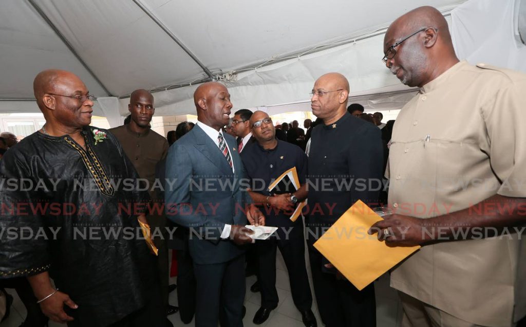 WHEN WE WERE FRIENDS: FLASHBACK: Prime Minister Dr Keith Rowley, 3rd from left, speaks with trade union leaders in this 2016 file photo when the National Tripartite Advisory Council (NTAC) was formed. The trade unions have since left the council.   - FILE PHOTO