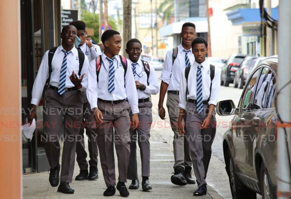 In this January 2020 photo, students of Queen's Royal College, Port of Spain head home at the end of the first day of school following the Christmas vacation. Photo by Sureash Cholai