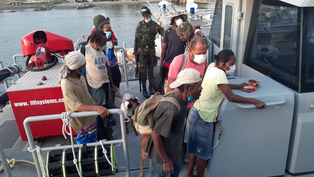 Vincentians in the red zone in Owia are evacuated by the Coast Guard on Tuesday. Photo courtesy SVG Coast Guard 