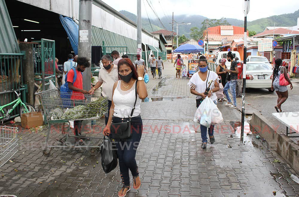 In this August 2020 file photo,  mask-wearing shoppers leave the Tunapuna market.

Photo by Angelo Marcelle