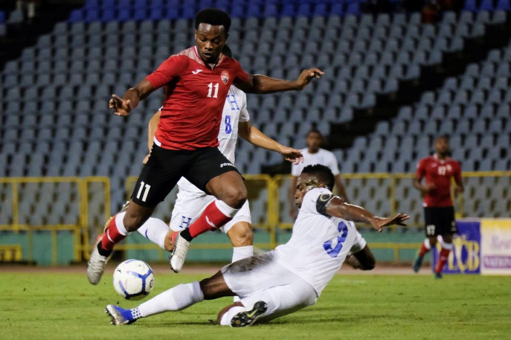 TT's Levi Garcia, left, in a 2019 Concacaf Nations League match against Honduras at the Hasely Crawford Stadium, Mucurapo. - AFP