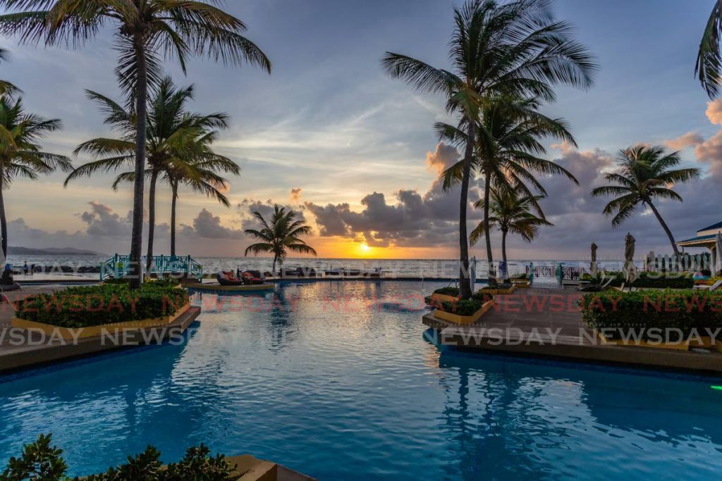 Sunrise over the horizon at The Magdalena Grand Beach & Golf Resort, Lowlands, Tobago. - JEFF K MAYERS