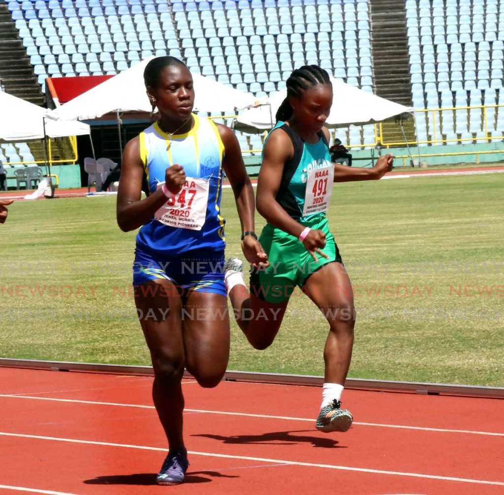 In this Feb 14, 2021 file photo, Janeil Morris (left) crosses the finish line to win the women’s 100m, at the NAAA’s track and field test event, at the Hasely Crawford Stadium, Port of Spain. On Monday, NAAA president George Comissiong said the association is in contact with the Ministry of Health with hopes of holding track meets. - SUREASH CHOLAI