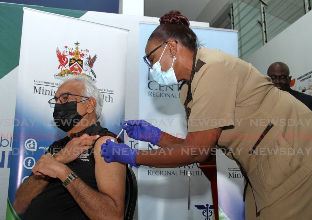 Health Minister Terrence Deyalsingh being vaccinated. - Photo by Ayanna Kinsale