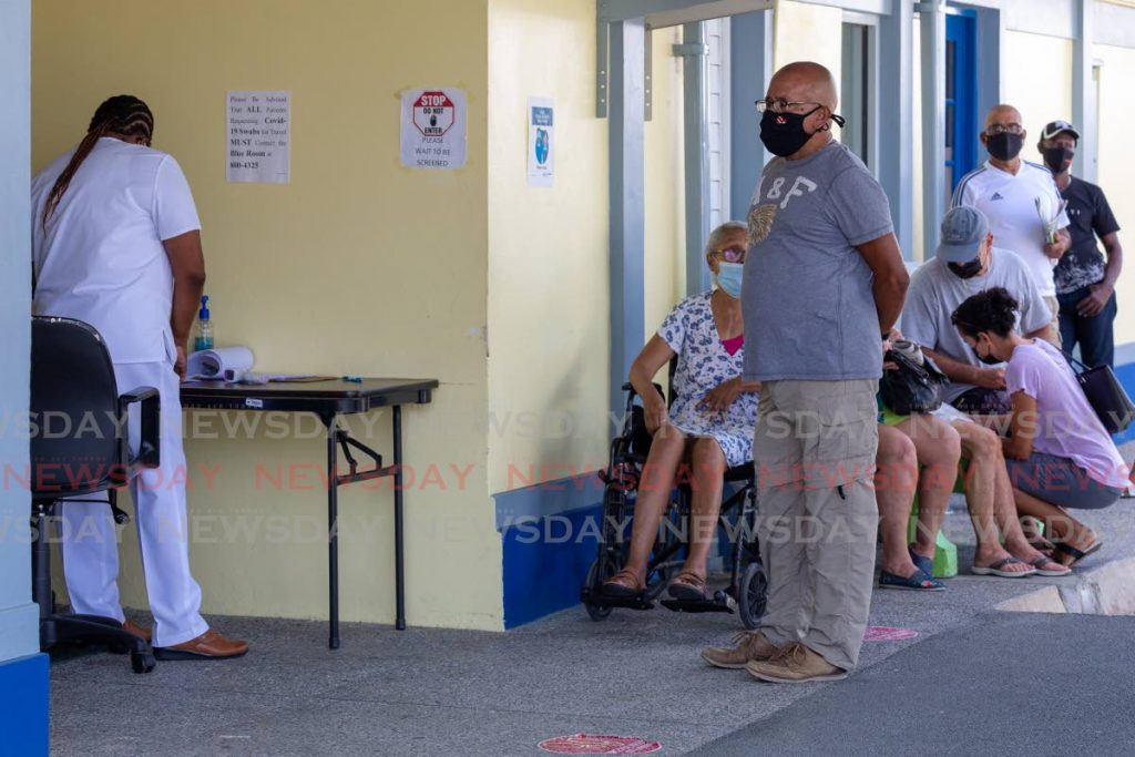 Patients outside the Canaan Health Centre during the vaccination drive in Tobago. - David Reid