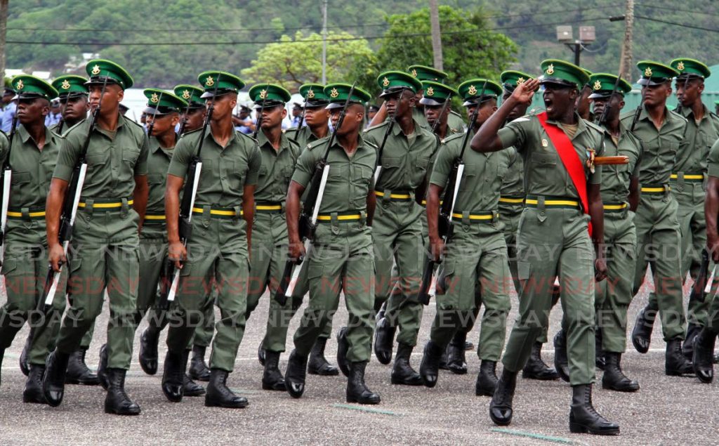 TTDF recruits march during a TTDF joint recruit passing out parade, at Teteron Barracks in Chaguaramas on Monday. - Photo by Angelo Marcelle