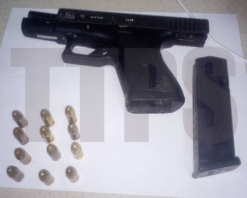 File photo of a firearm and ammunition police retrieved at the scene. - Photo courtesy TTPS