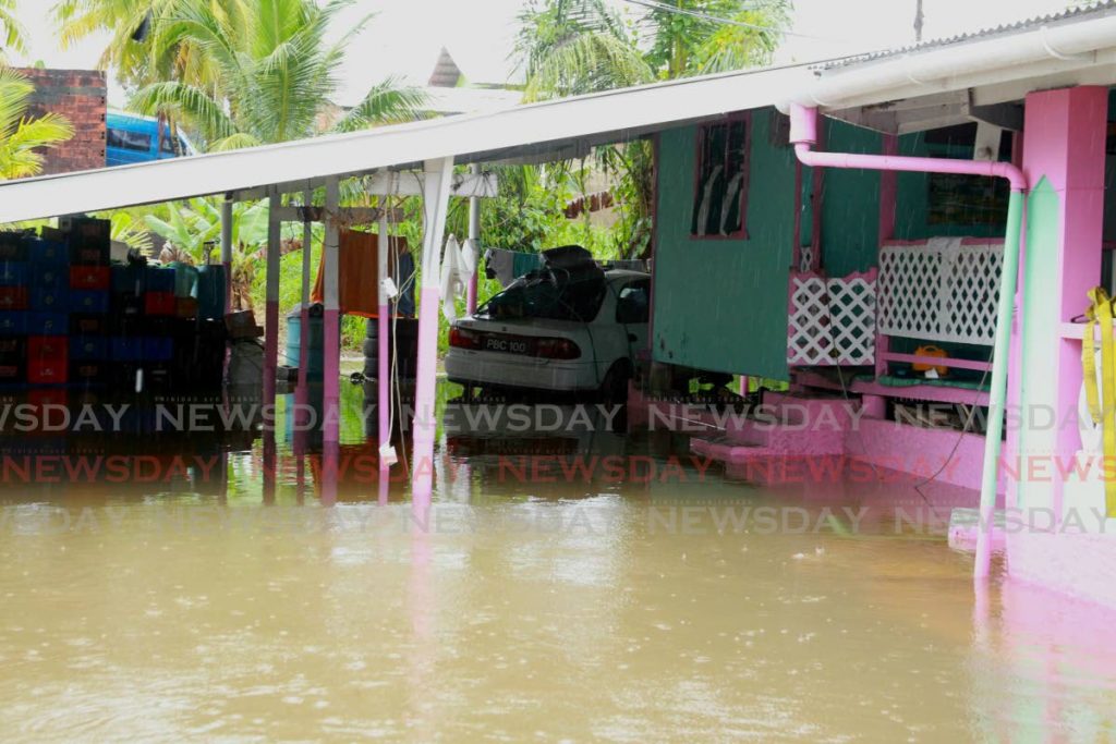A flooded home in Coalmine, Sangre Grande, on Tuesday. - ROGER JACOB