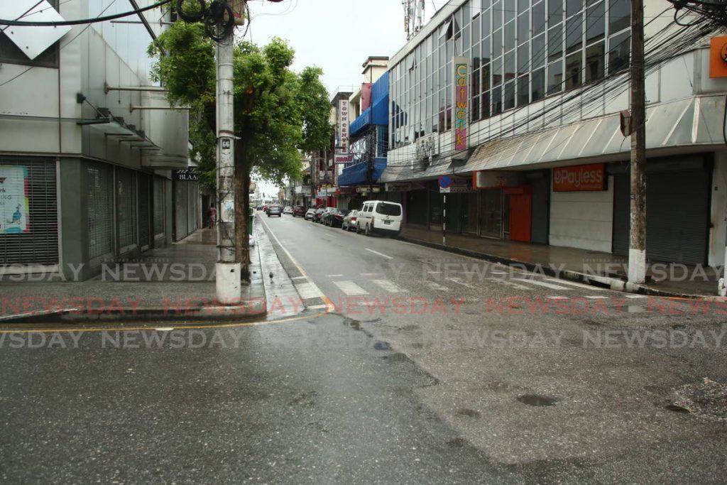 Lower Frederick St, Port of Spain, usually bustling with people on weekdays, was almost deserted on Tuesday after government ordered all non-essential retail stores closed in an effort to control the recent spike in covid19 infections. - Sureash Cholai