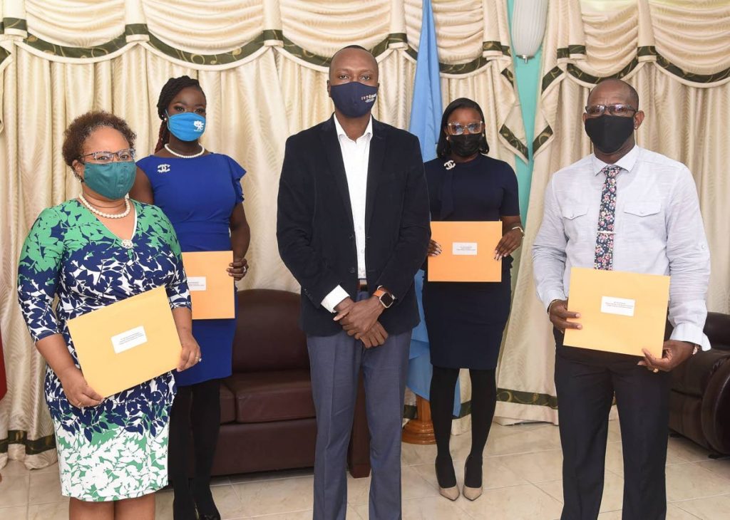 Chief Secretary Ancil Dennis, centre, with reinstalled Tobago Festivals Commission chairman Dr Denise Tsoiafatt Angus, left, directors Adana Roberts. back left, and Tonya Lee Williams, back right, and deputy chairman Ancil Thorne. - 