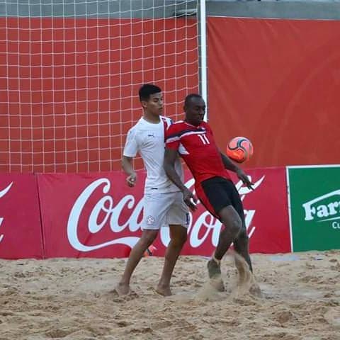 TT beach soccer player Kevon 'Showtime' Woodley (right) controls the ball ahead of a Paraguay defender during their practice match at Gran Asuncion, Paraguay on Monday. PHOTO COURTESY TTFA MEDIA. - 