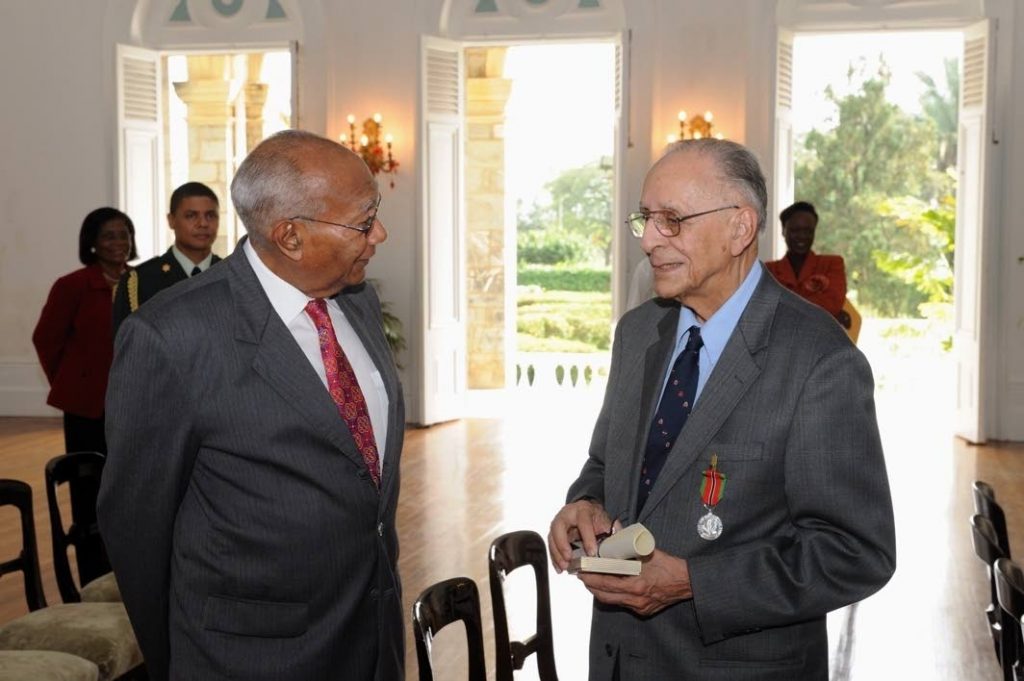 Prof Leslie Spence, right, speaks to former president George Maxwell Richards at the National Awards ceremony, President's House in 2009. Spence was awarded the Chaconia Medal (silver) for his contribution in the field of medicine. - 