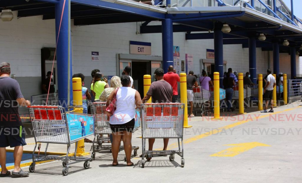 Customers line up outside Pricesmart in Port of Spain. Photo by Sureash Cholai - SUREASH CHOLAI