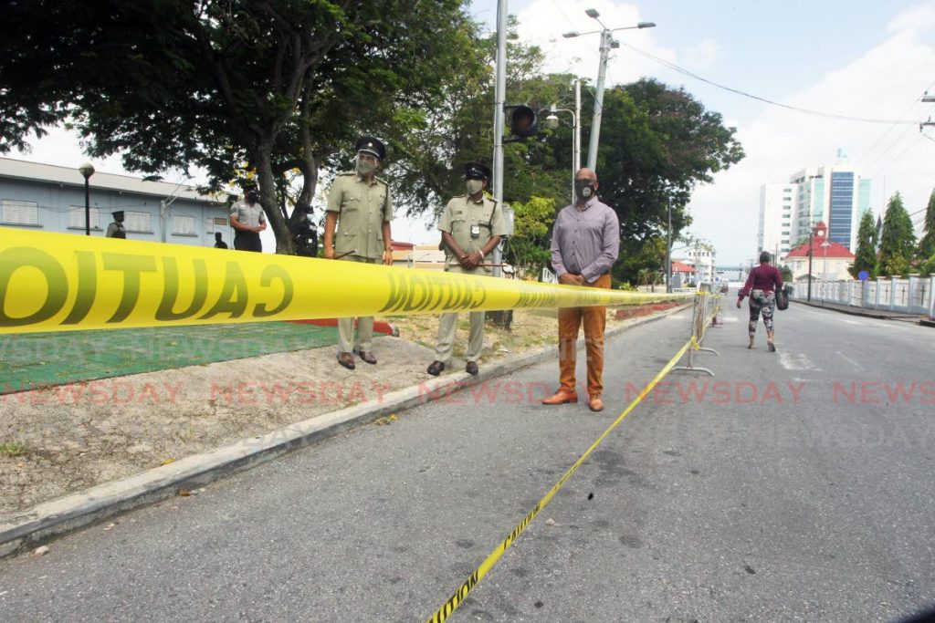 File photo of former mayor of San Fernando Junia Regrello and senior municipal police officers standing on Harris Promenade, San Fernando. - Photo by Lincoln Holder