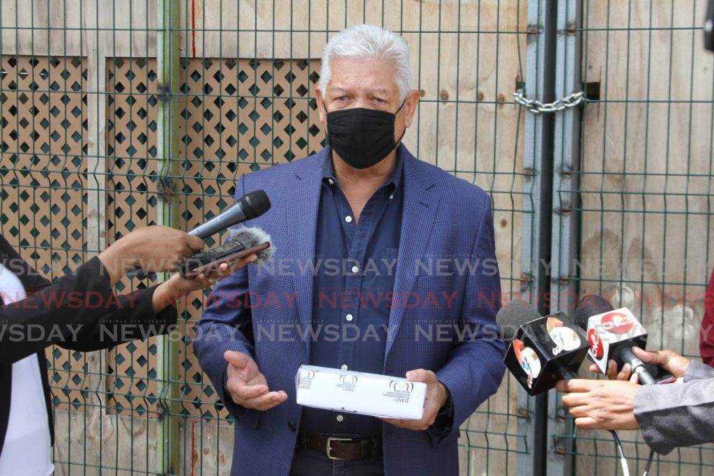 Port of Spain Mayor Joel Martinez speaks to the media after receiving the keys for the Centre for Socially Displaced Persons at the Riverside Plaza car park. Photo by Marvin Hamilton - Marvin Hamilton