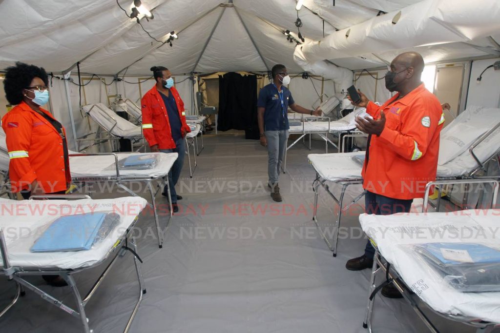 CEO of the NCRHA Davalin Thomas, general manager of nursing Dianne Hinneh, medical chief of staff Dr Ravi Lalla and hospital administrator Mandell Moise during a site visit to the field hospital. - Photo by  Lincoln Holder