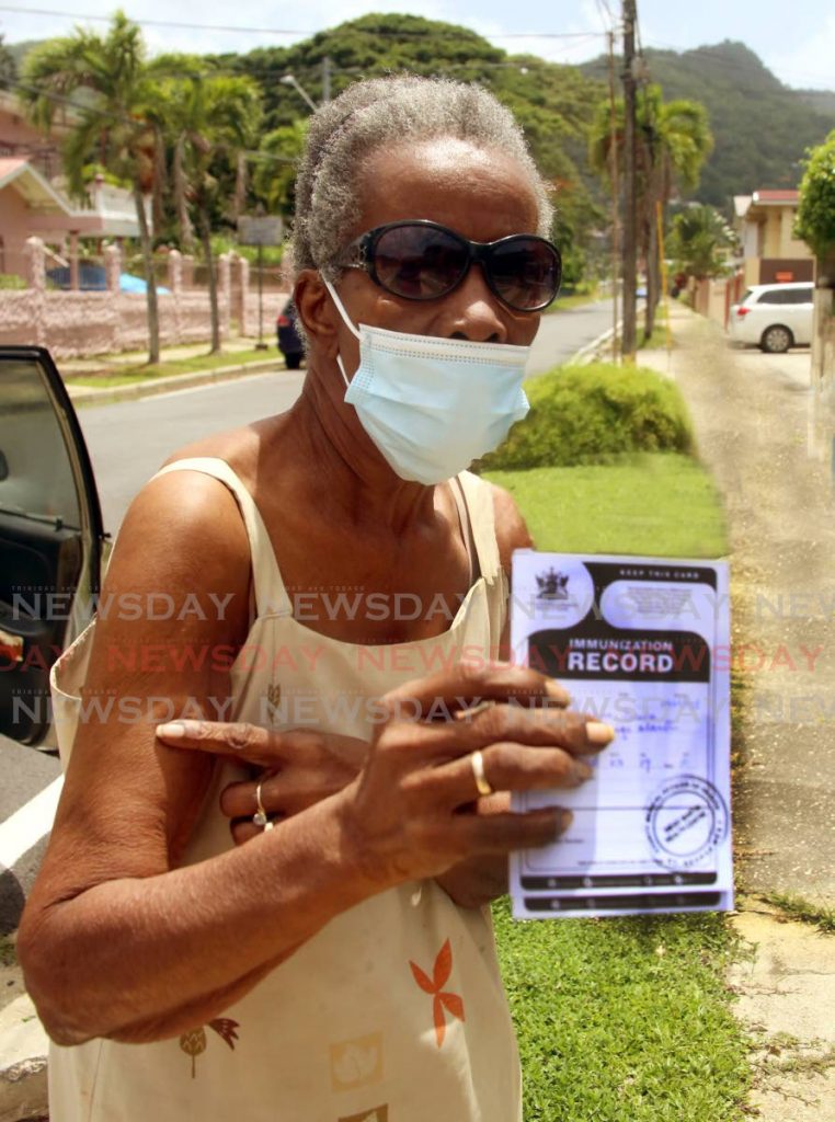 Ivy Lashley, 85 years old, points to her arm where she was administered the covid19 vaccine at the Deigo Martin Health Centre. Photo by Sureash Cholai - SUREASH CHOLAI