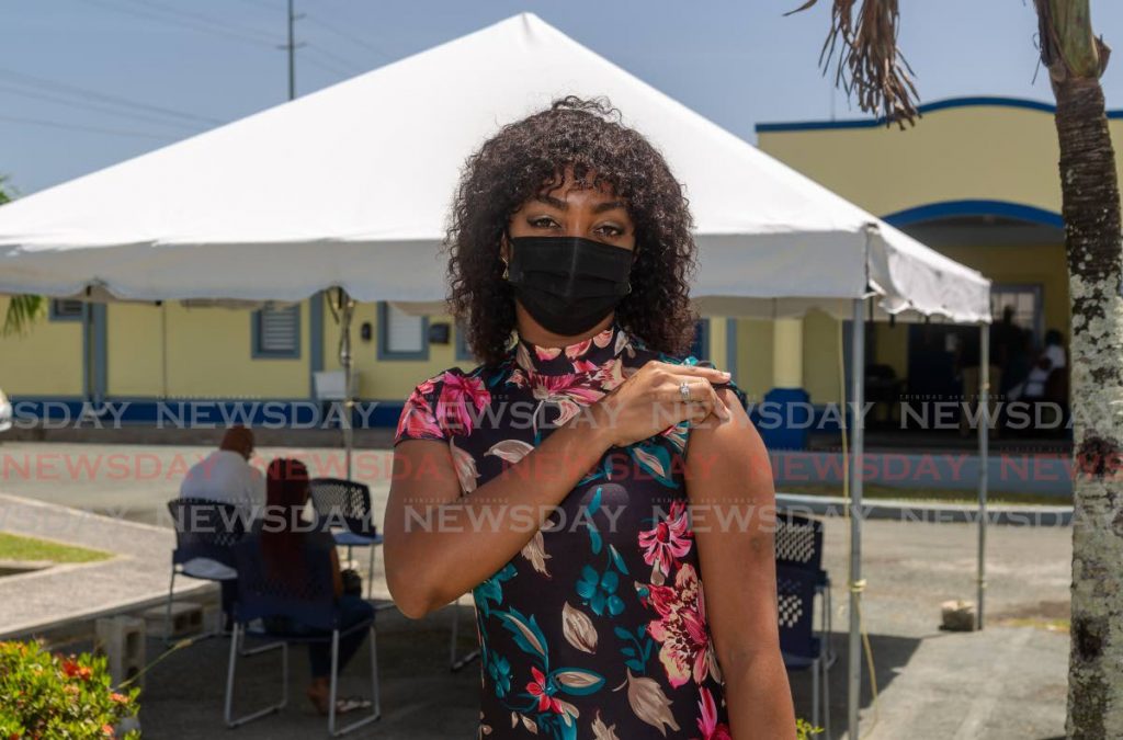 Tracyann Daniel shows her arm after receiving her covid19 vaccine jab at Canaan Health Centre, Tobago on Monday. PHOTO BY DAVID REID  - 