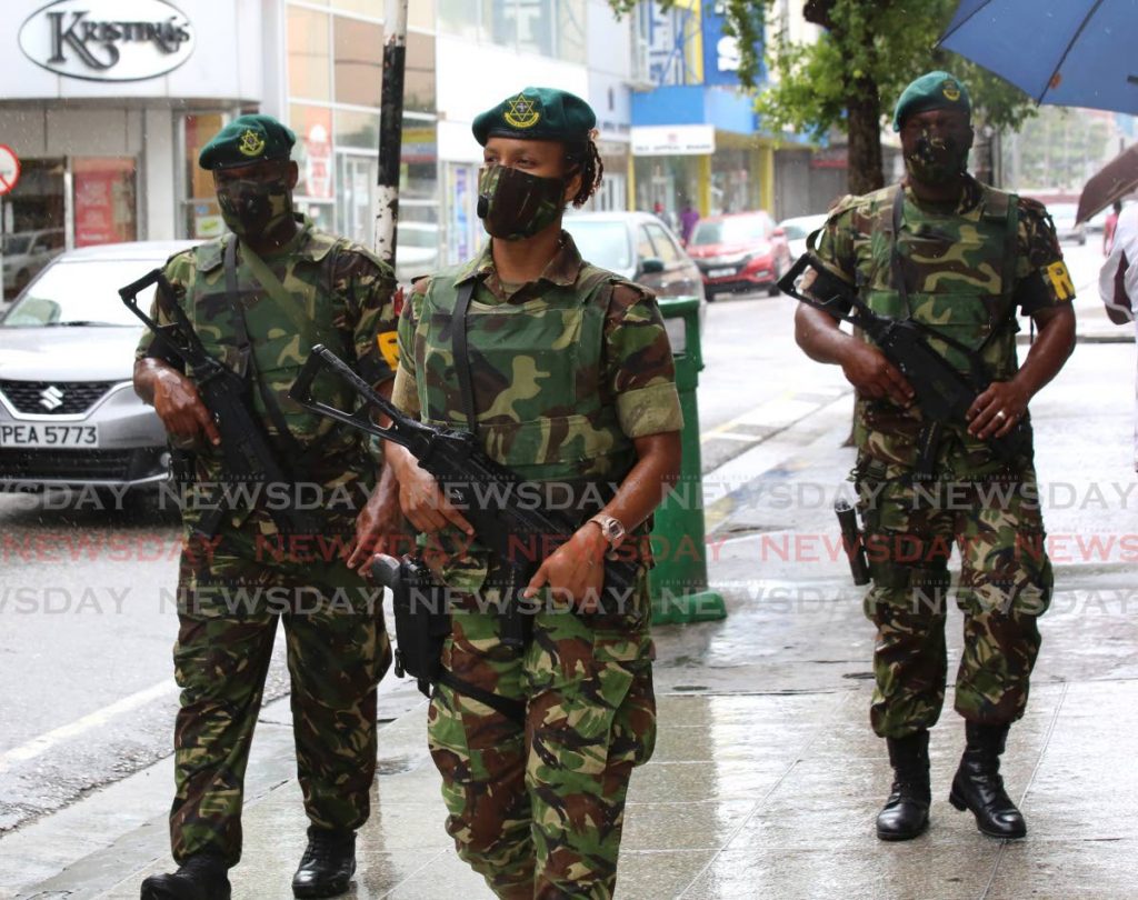 A group of soldiers patrolled the streets of Port of Spain on Thursday. Photo by Sureash Cholai