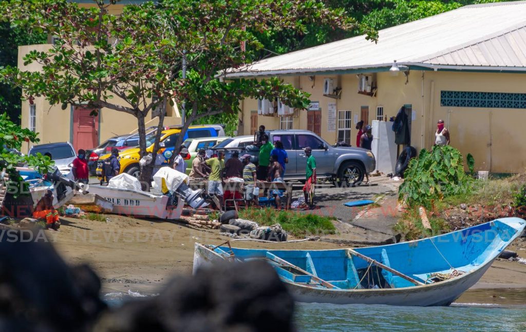 File photo: Police in Belle Garden, Tobago in May last year, where a boat with 14 decomposing bodies was towed ashore. - Photo by David Reid 