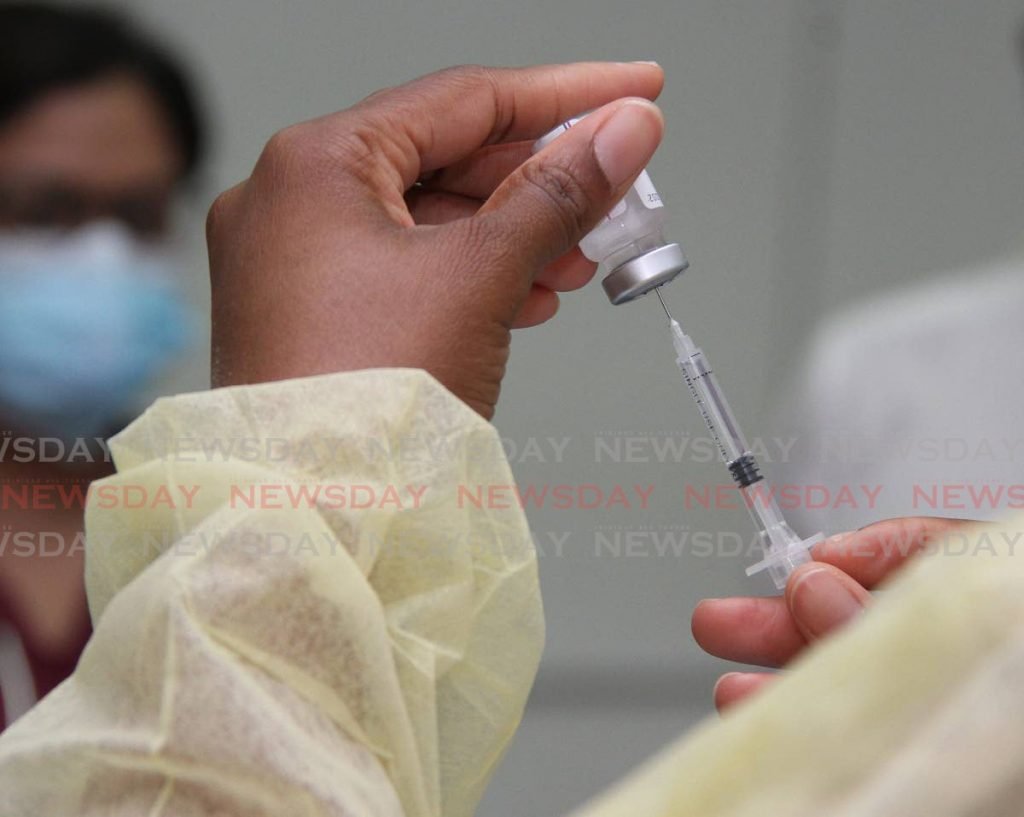 In this file photo a nurse gets ready to administer a Sinopharm vaccinate. - Photo by Angelo Marcelle
