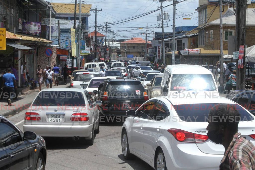 Traffic at the Croisee, San Juan on Saturday as people go about their business during the state of emergency which is supposed to limit the movement of people. - Photo by Marvin Hamilton