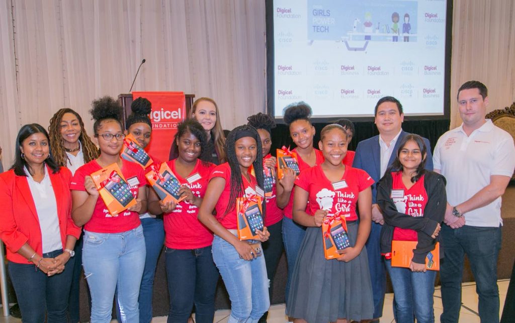 Some of the young women who participated in Girls Power Tech 2019 excitedly display their tablets which they received as prizes for their involvement in the initiative. - Photo courtesy the Digicel Foundation.