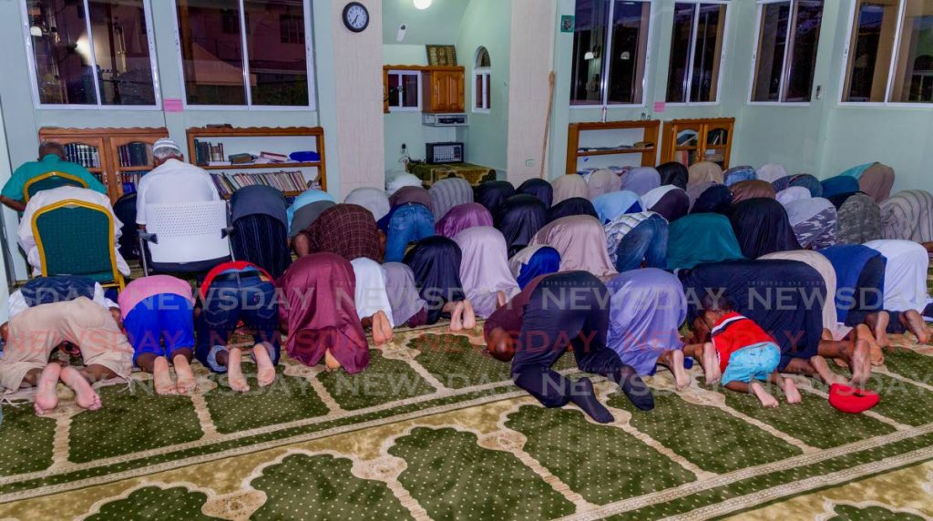 In this file photo, Muslims pray before they break fast at the Masjid Al Tawbah in Lowlands.  - Photo by David Reid